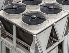 Industrial cooling units with multiple rooftop fans and pipework