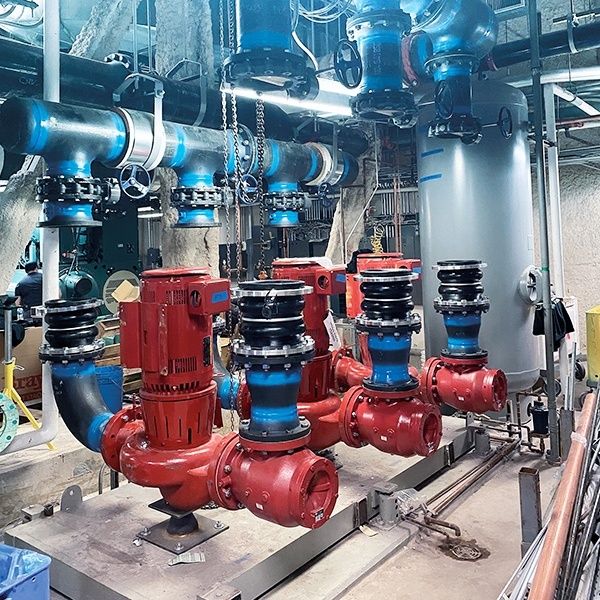 Industrial chilled-water piping, pumps, valves, and storage tank